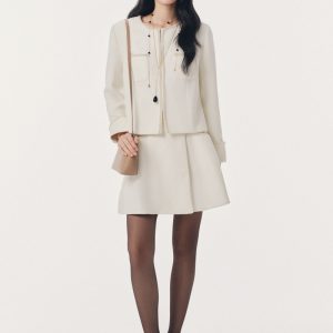 Áo khoác mặt tếch phối viền dây ngọc trai khâu tay